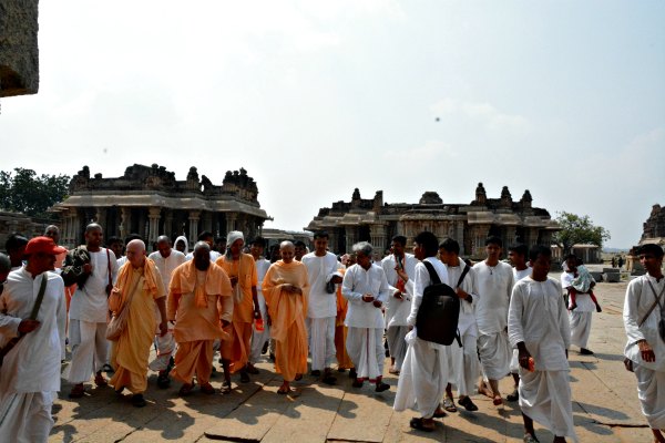 Radhanath Swami walking through the ruins of Vijayanagar Empire